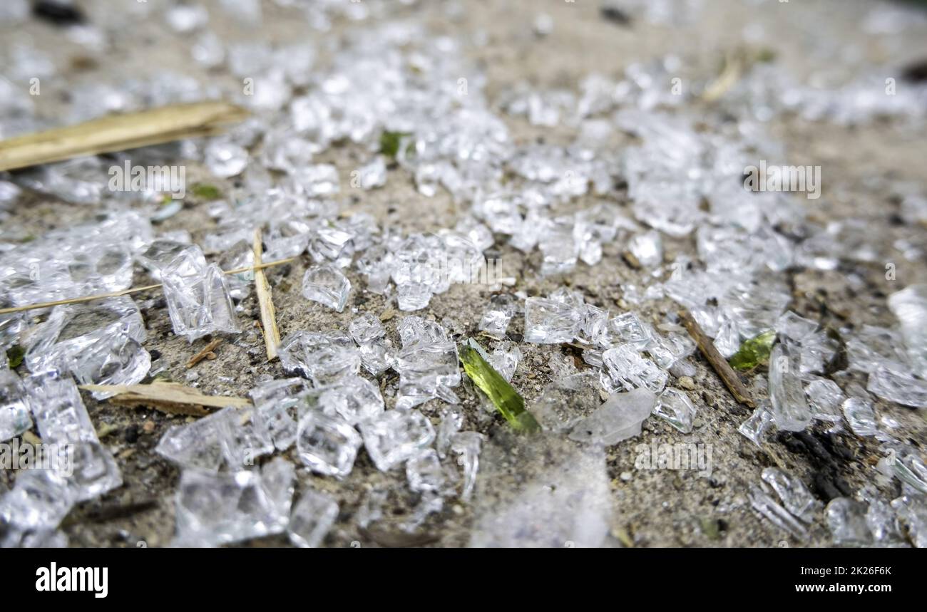 Detail of broken glass in the garbage, danger due to cuts Stock Photo
