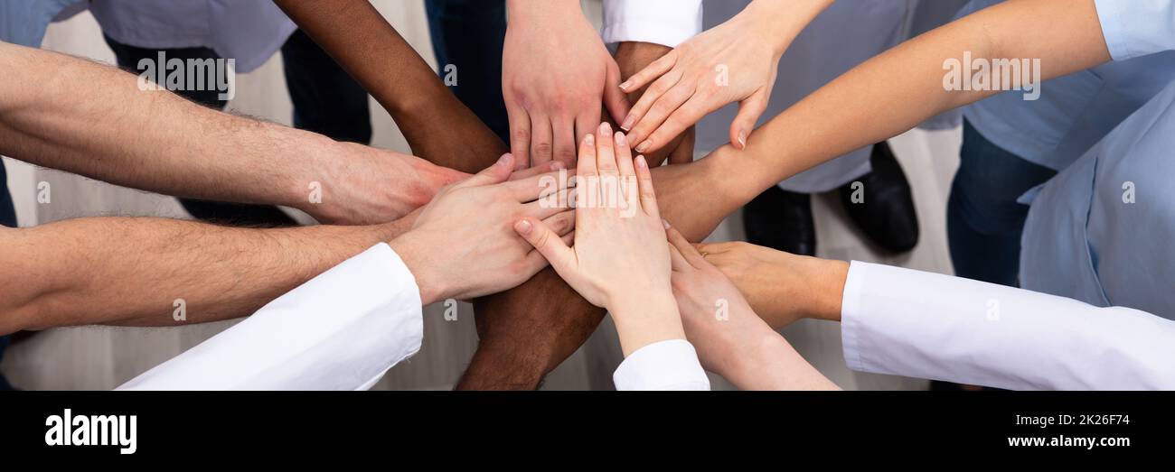 Elevated View Of Doctors Stacking Hands Stock Photo