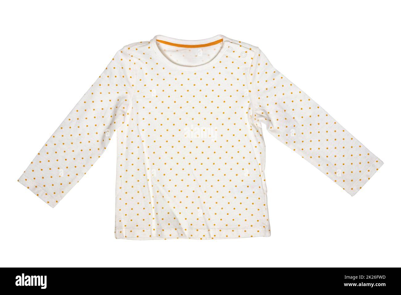 Summer shirt isolated. Closeup of a white baby girl shirt or t-shirt with yellow polka dots isolated on a white background. Children spring fashion. Stock Photo