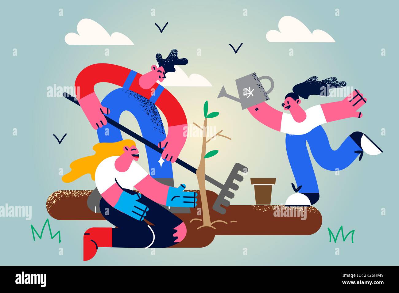 Happy people plant seedling in ground Stock Photo Alamy