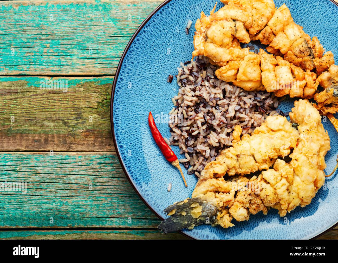 Deep fried sea bass with rice Stock Photo Alamy