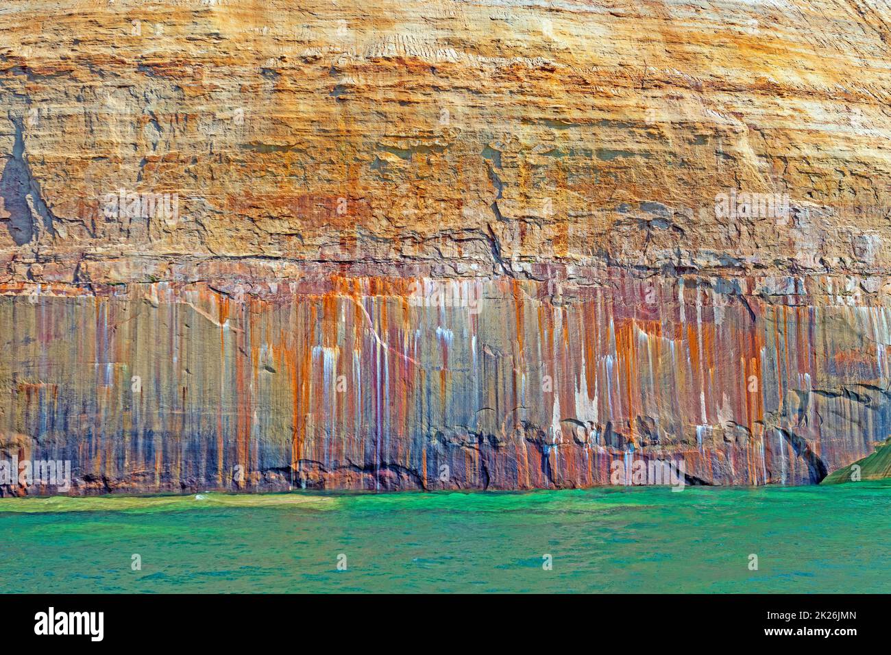 Colorful Minerals Leaching Through the Sandstone in Pictured Rocks National Lakeshore on Lake Superior in Michigan Stock Photo