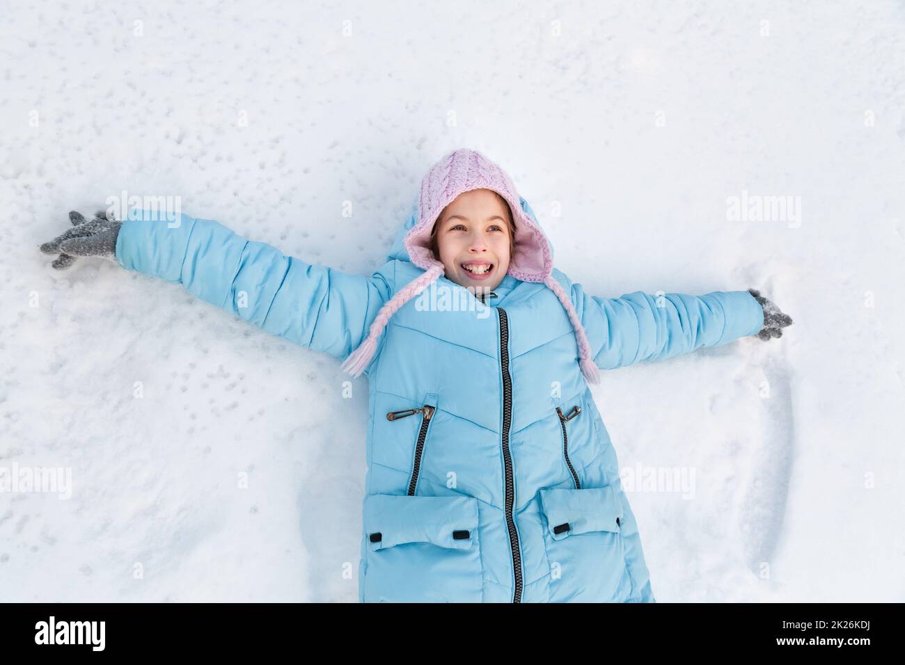 Portrait of a girl in winter in a hat and jacket Stock Photo