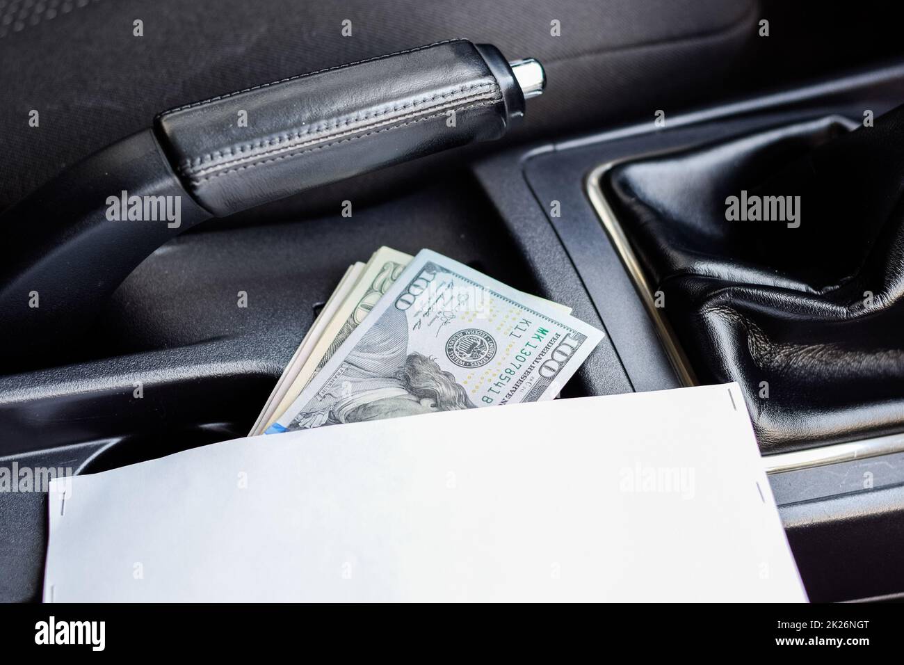 wad of dollars inside the car Stock Photo Alamy
