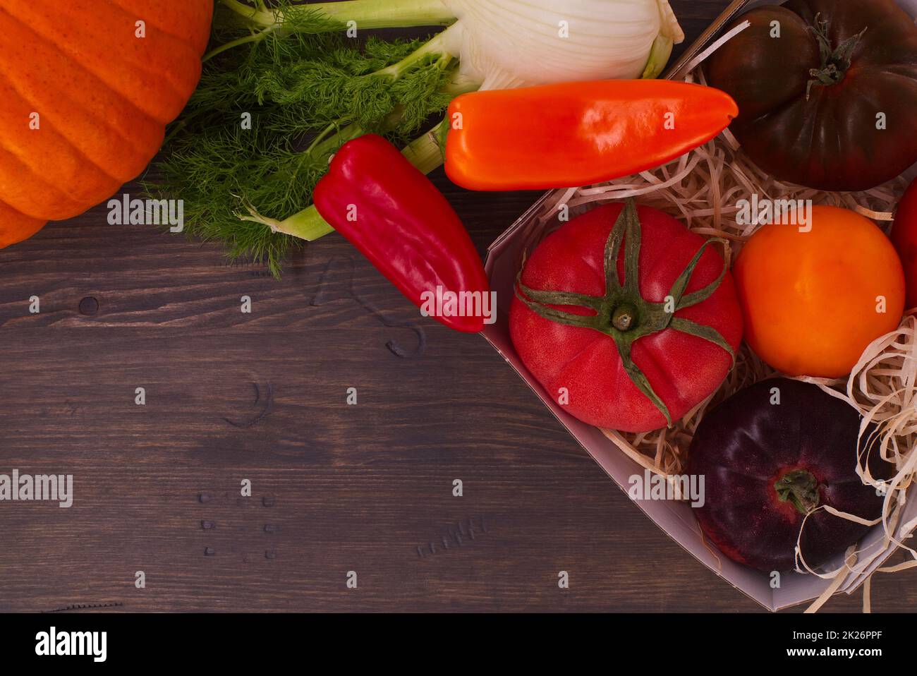 Side border with assorted varieties and colors of tomatoes Stock Photo