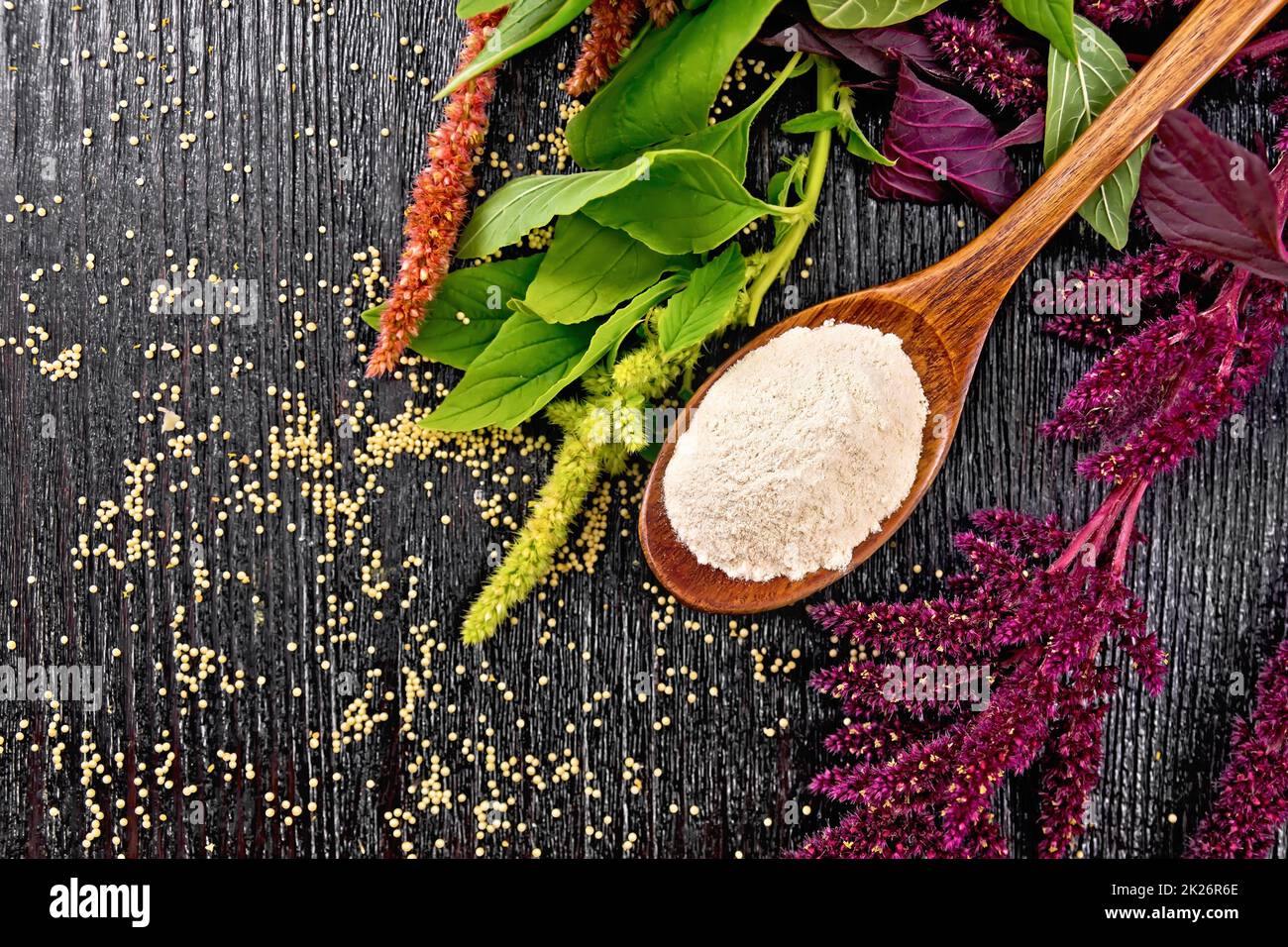 Flour amaranth in spoon on board top Stock Photo