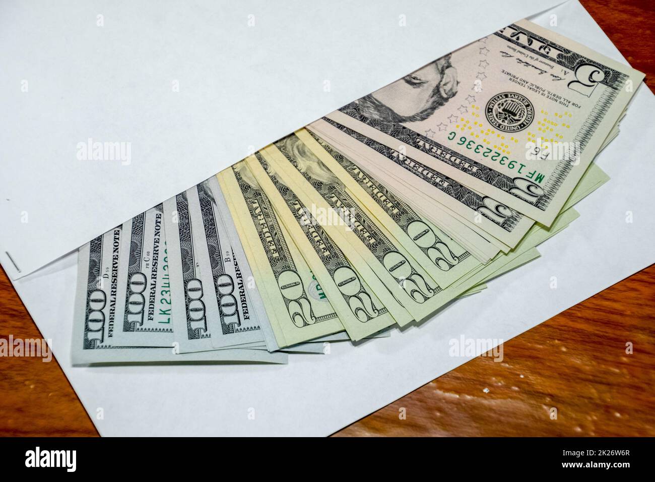 Dollars on table with an envelope. Money in an envelope. U.S. dollars. Stock Photo