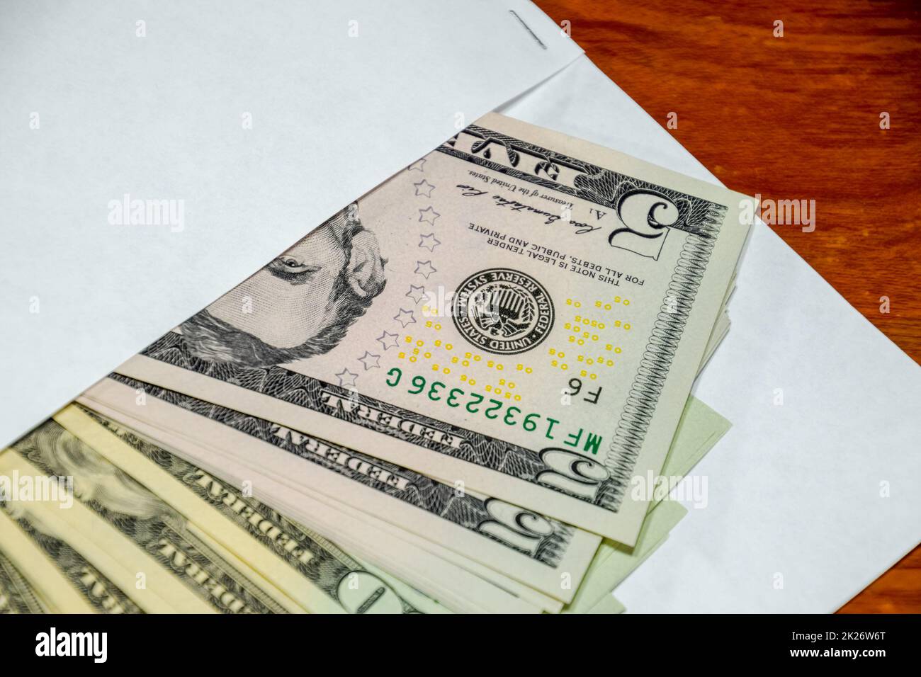 Dollars on the table with an envelope. Money in an envelope. U.S