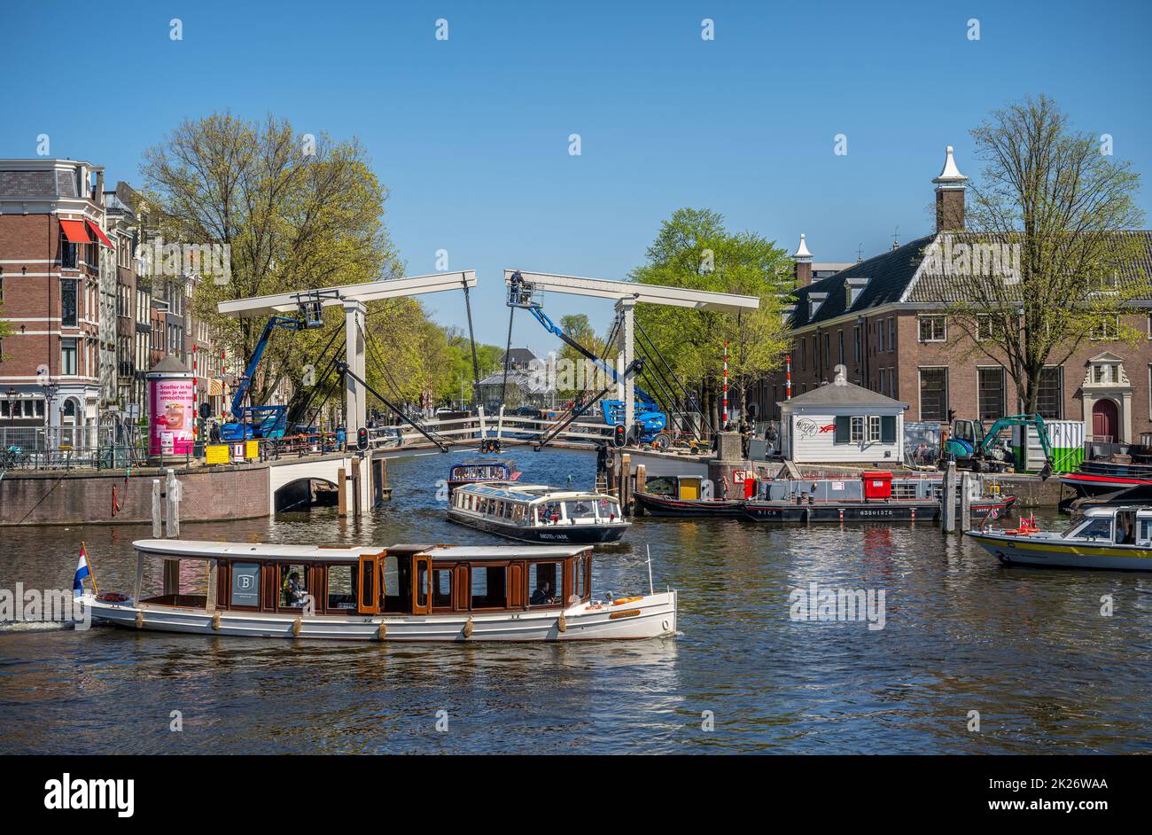 Traditional swing bridge at the Herengracht junction with the river Amstel. Stock Photo