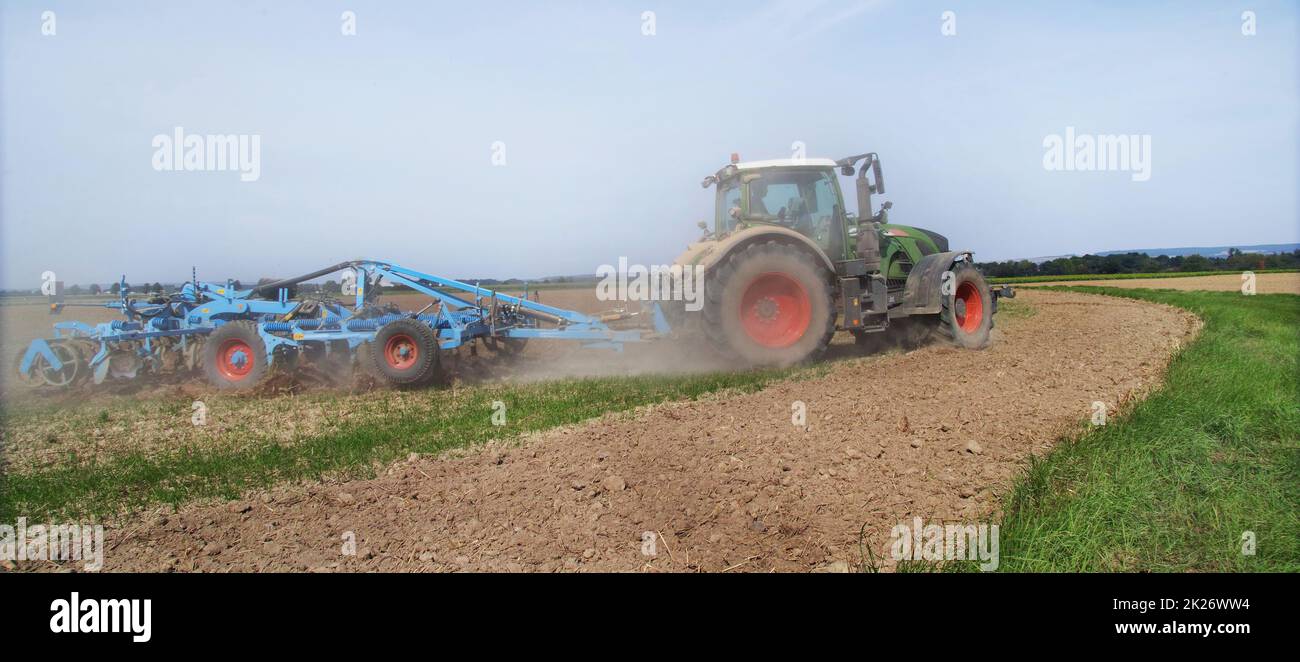 Agricultural cultivating on farmland. Stock Photo