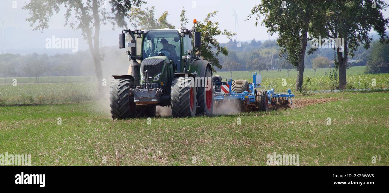 Agricultural cultivating on farmland. Stock Photo