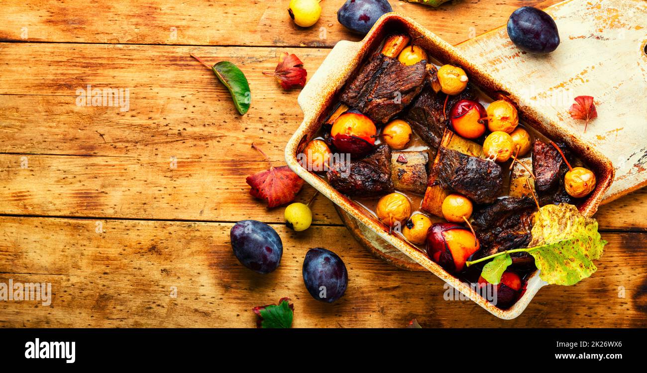 Beef ribs baked in plums,space for text Stock Photo