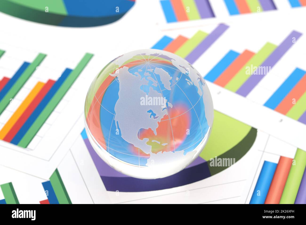 Glass globe of North and South America with graph printed documents Stock Photo