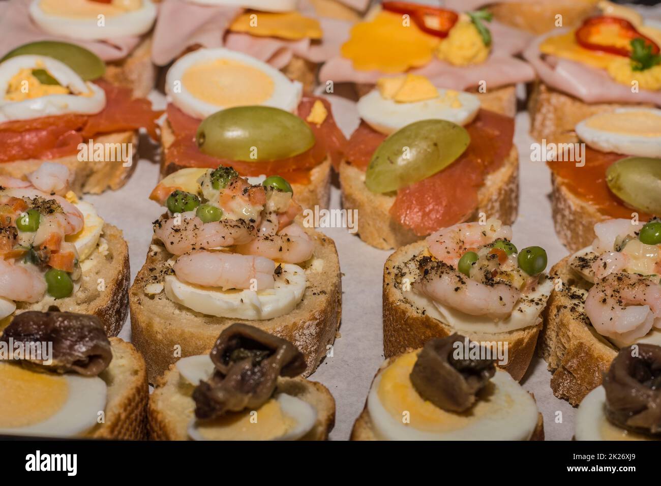 fresh tasty sandwiches at a party with fish and eggs Stock Photo