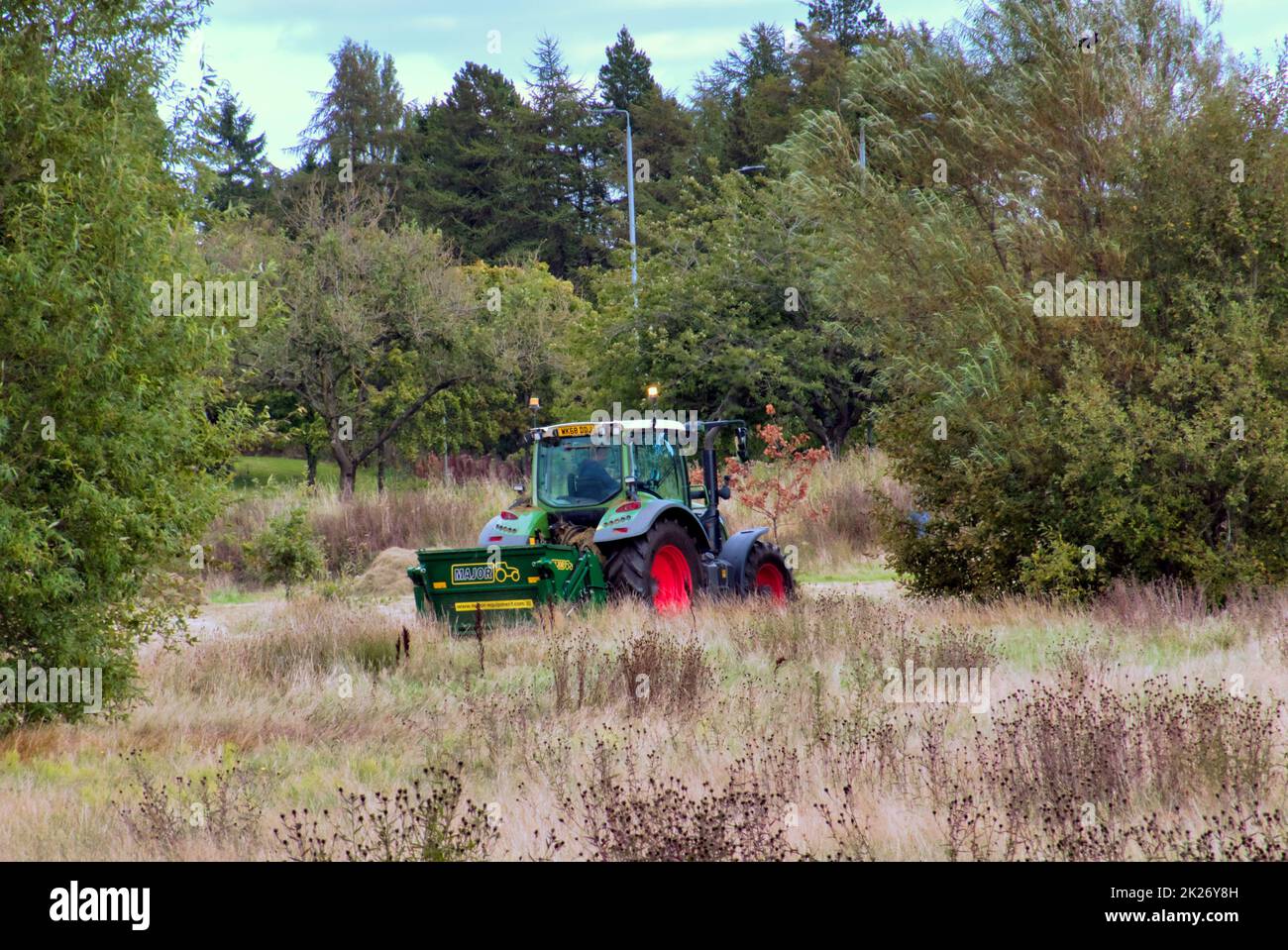 Glasgow, Scotland, UK 22nd September, 2022.  An area of scrub land between the forth and clyde canal tow path and the A82 great western road is tractor cut ready for re wilding naturally for wild-flowers and plants suitable for bees and insects under the greenspace program. Credit Gerard Ferry/Alamy Live News Stock Photo