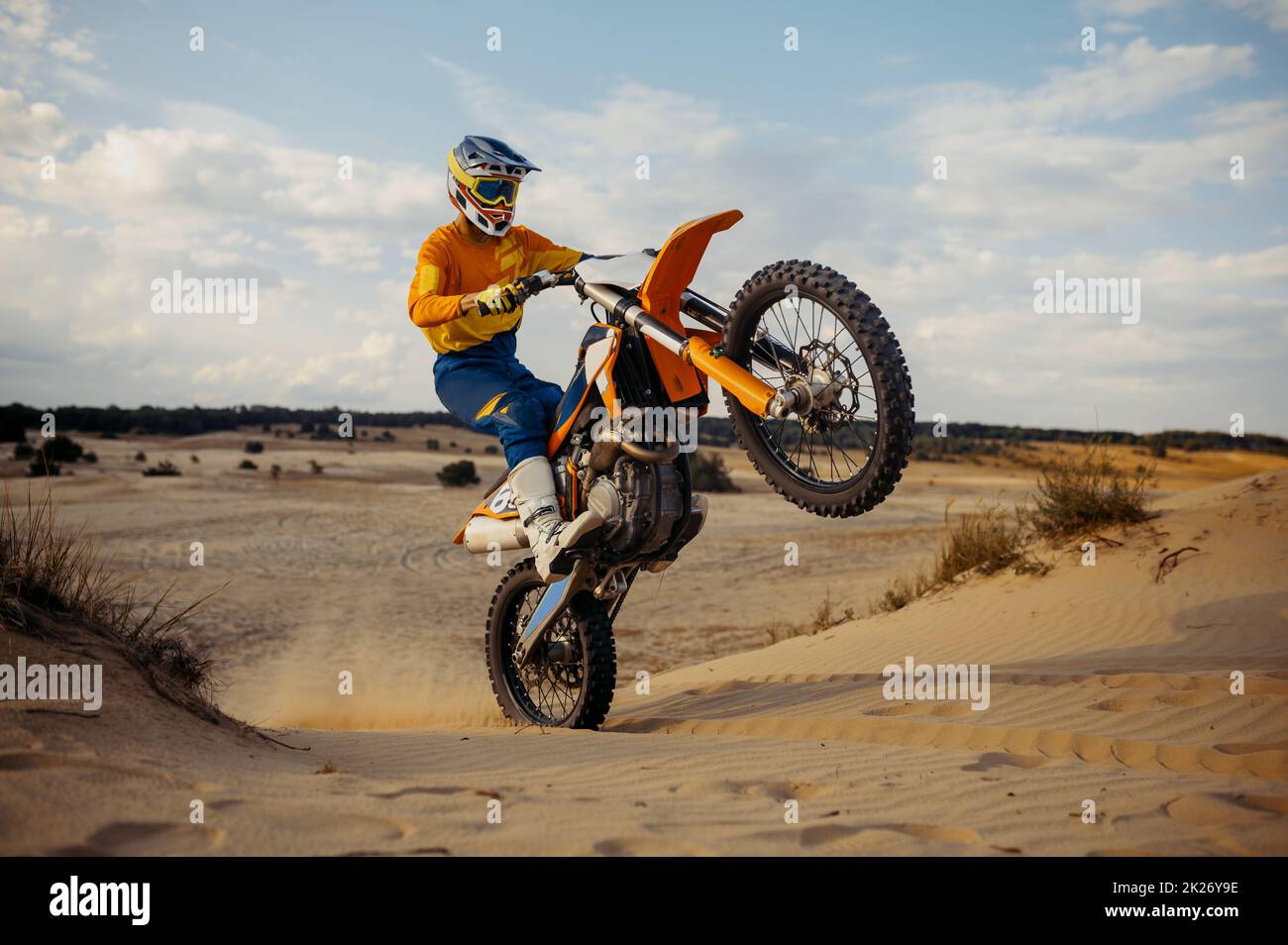 Free Photo  Moto rider making a stunt on his motorbike biker