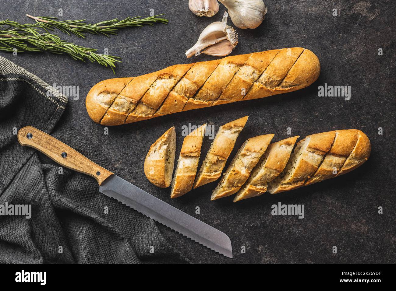 Roasted baguette with garlic butter. Crunchy sliced garlic bread on