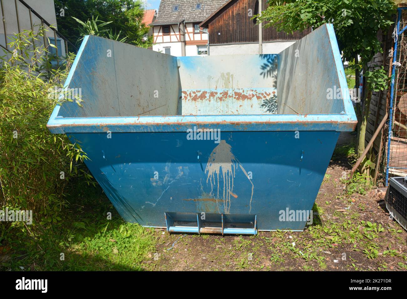One large empty waste container in a courtyard Stock Photo Alamy