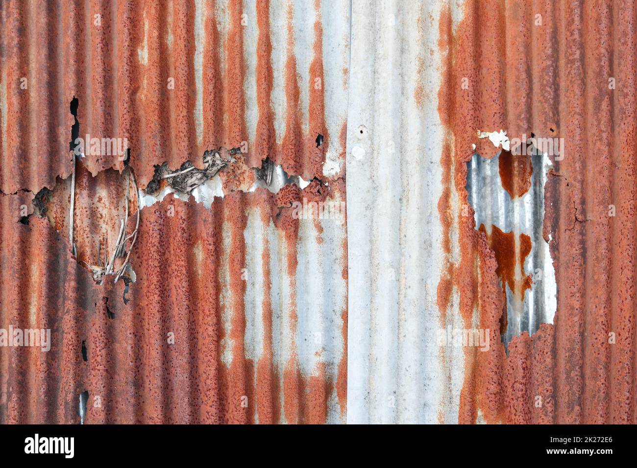 Rust that corrosion  metal surfaces causes strange colors. The surface of the metal is rusted, corrosion causes the metal to look old because of the c Stock Photo