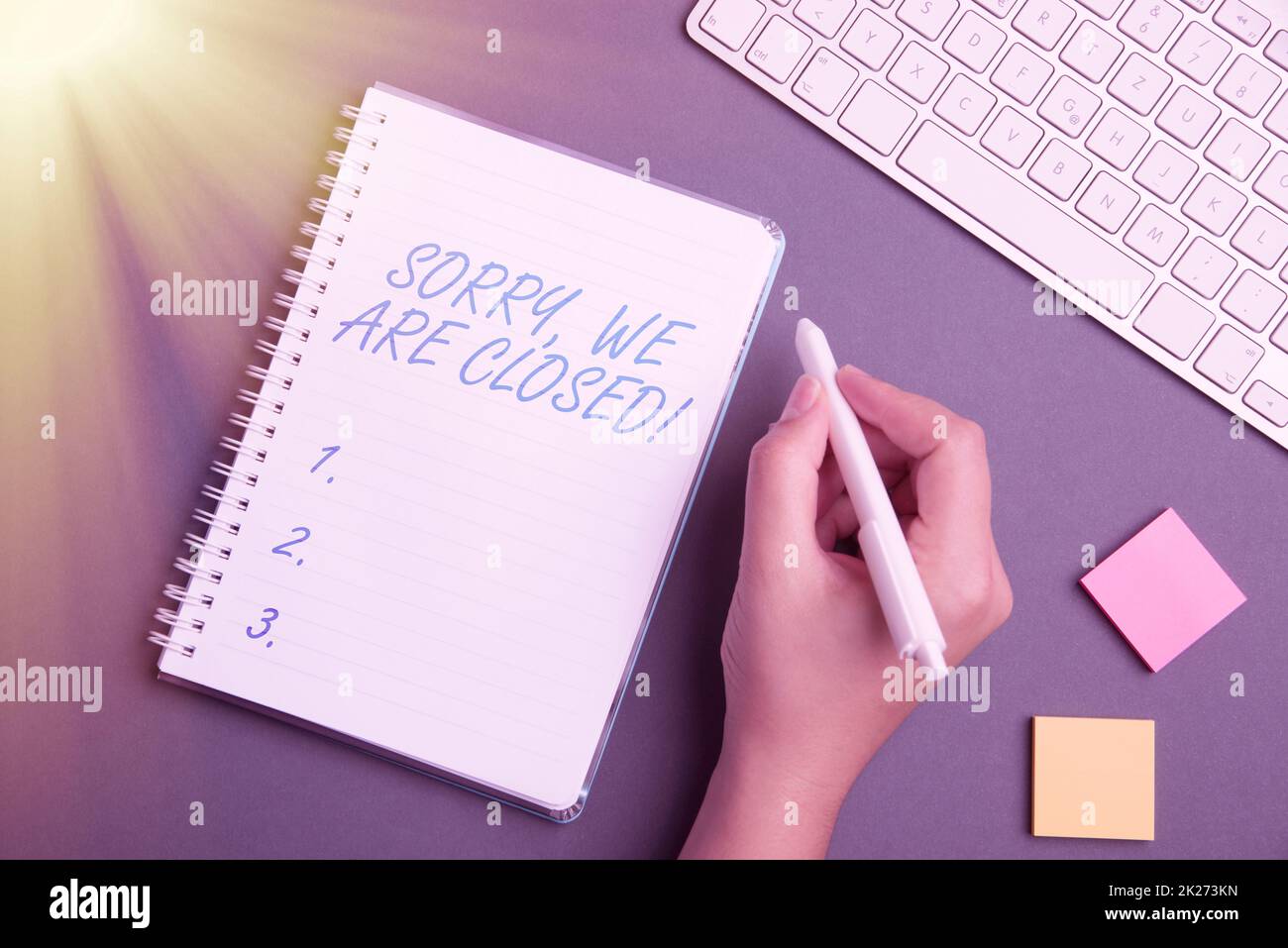 Inspiration showing sign Sorry, We Are Closed. Word for apologize for shutting off business for specific time Keyboard Over A Table Beside A Notebook And Pens With Sticky Notes Stock Photo