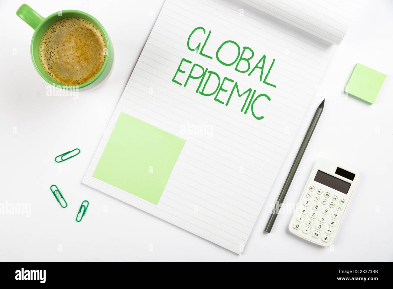 Writing displaying text Global Epidemic. Business showcase a rapid spread of a communicable disease over a wide geographic area Multiple Assorted Collection Office Stationery Photo Placed Over Table Stock Photo