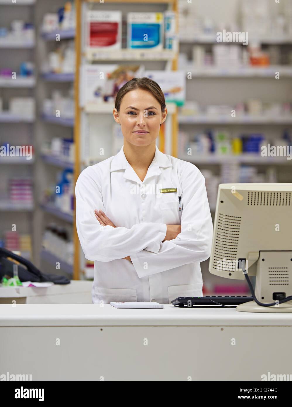 Treatments begin with her. Portrait of an attractive young pharmacist standing at the prescription counter. Stock Photo