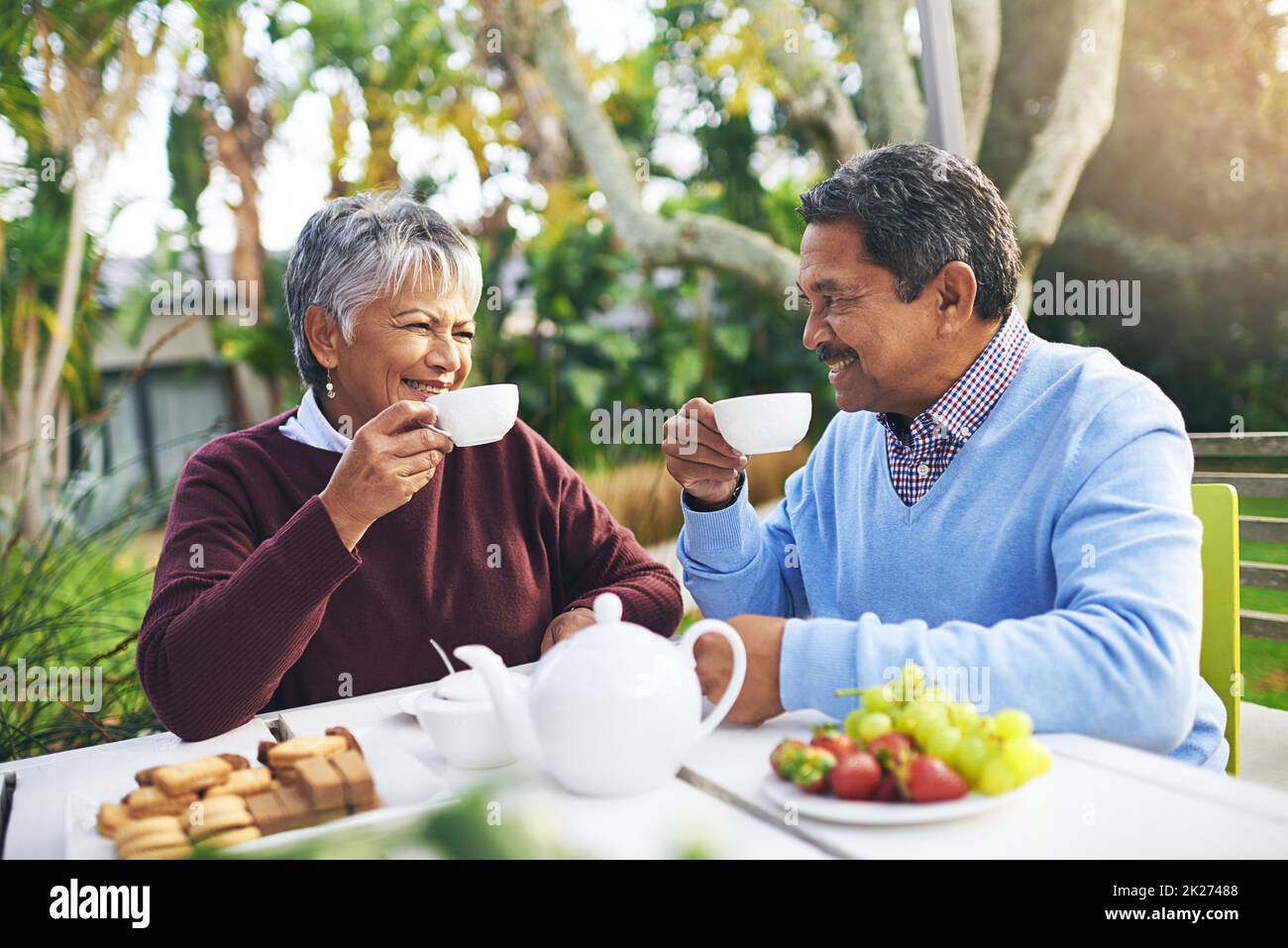 Retirement done right. Shot of a happy older couple having tea together outdoors. Stock Photo