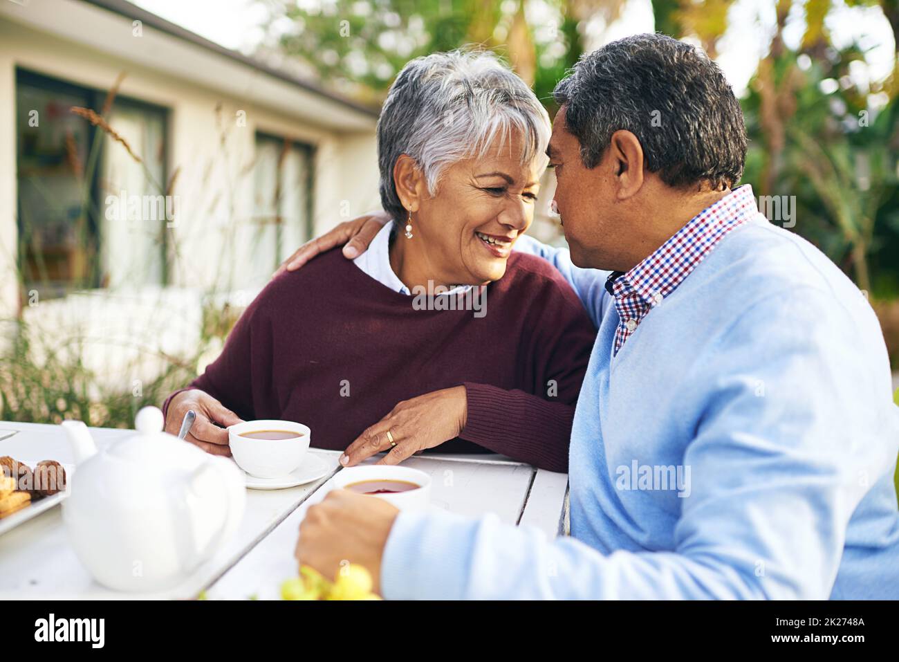 Retirement - More time for romance. Shot of a happy older couple having tea together outdoors. Stock Photo