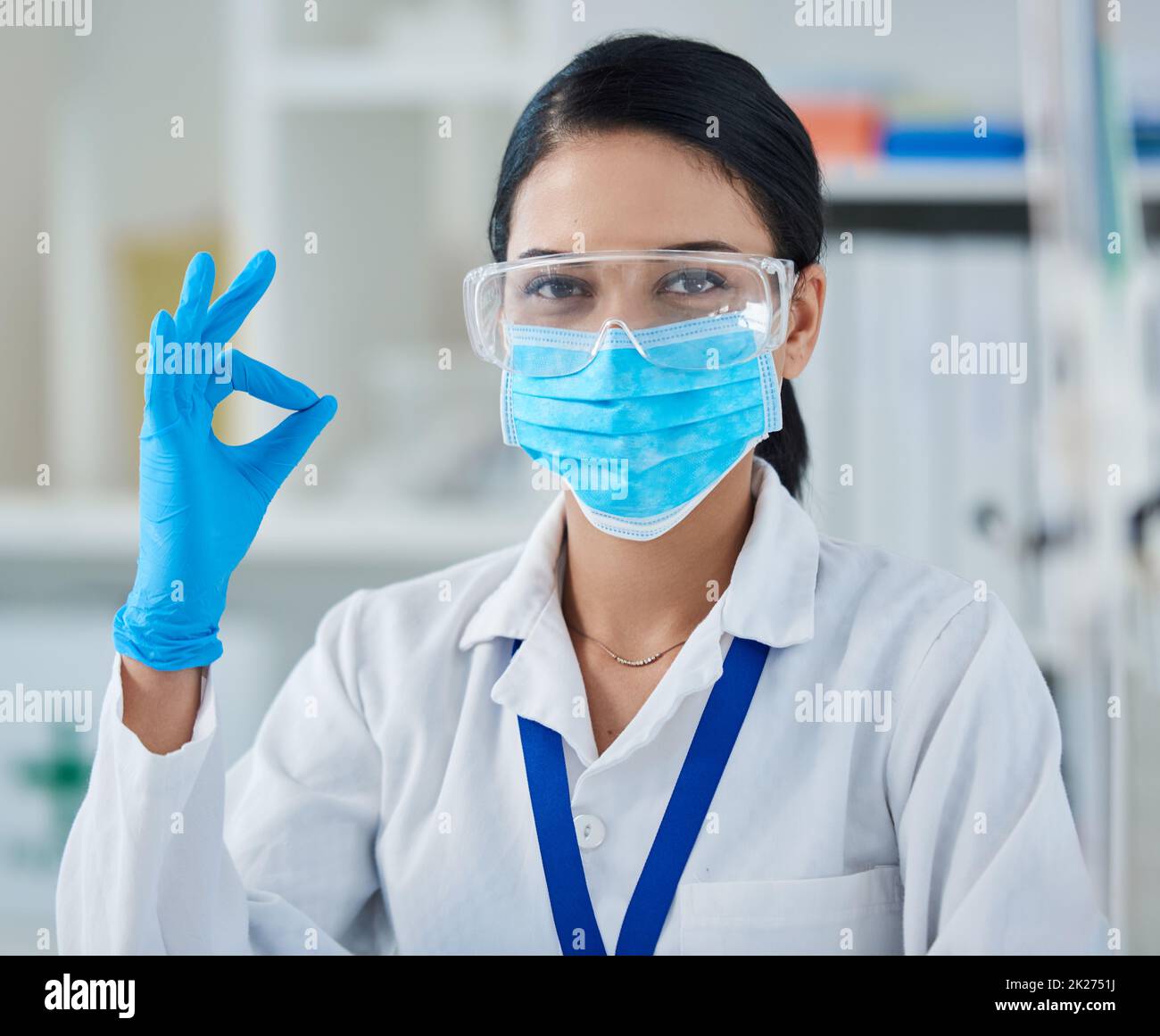 When your testing confirms your theory. Portrait of a confident young woman making an okay gesture in a laboratory. Stock Photo