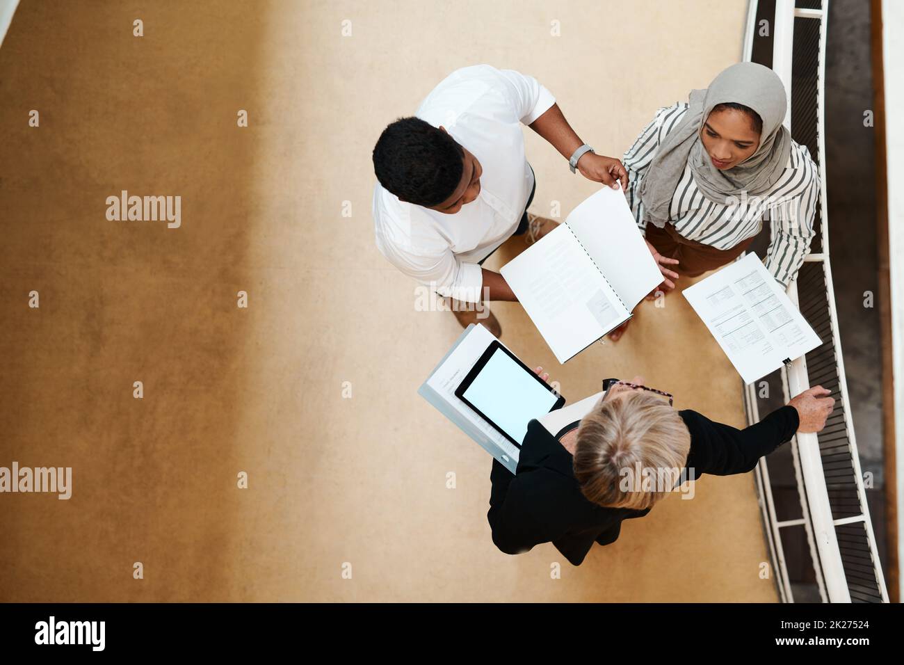 Finalising their big plans for success. High angle shot of a group of ...
