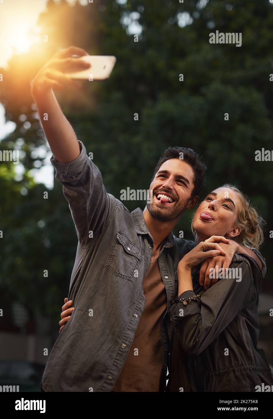 We love taking selfies. Shot of a young couple taking a selfie in the