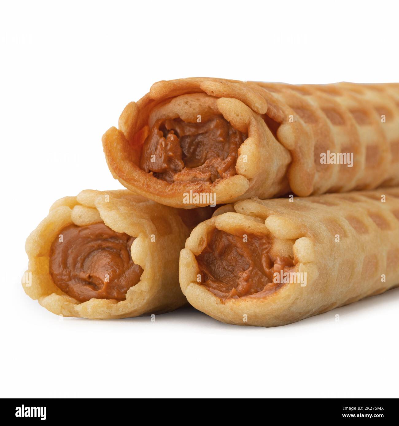 Wafer rolls with condensed milk isolated on white background Stock Photo