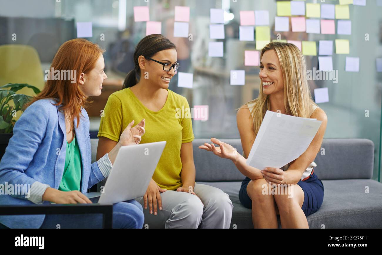 We should work together everyday. Shot of three attractive females expressing positivity in the office. Stock Photo