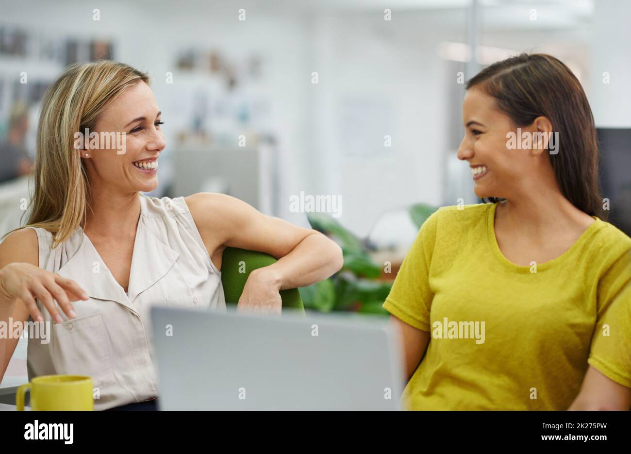Two business women laughing hi-res stock photography and images - Alamy