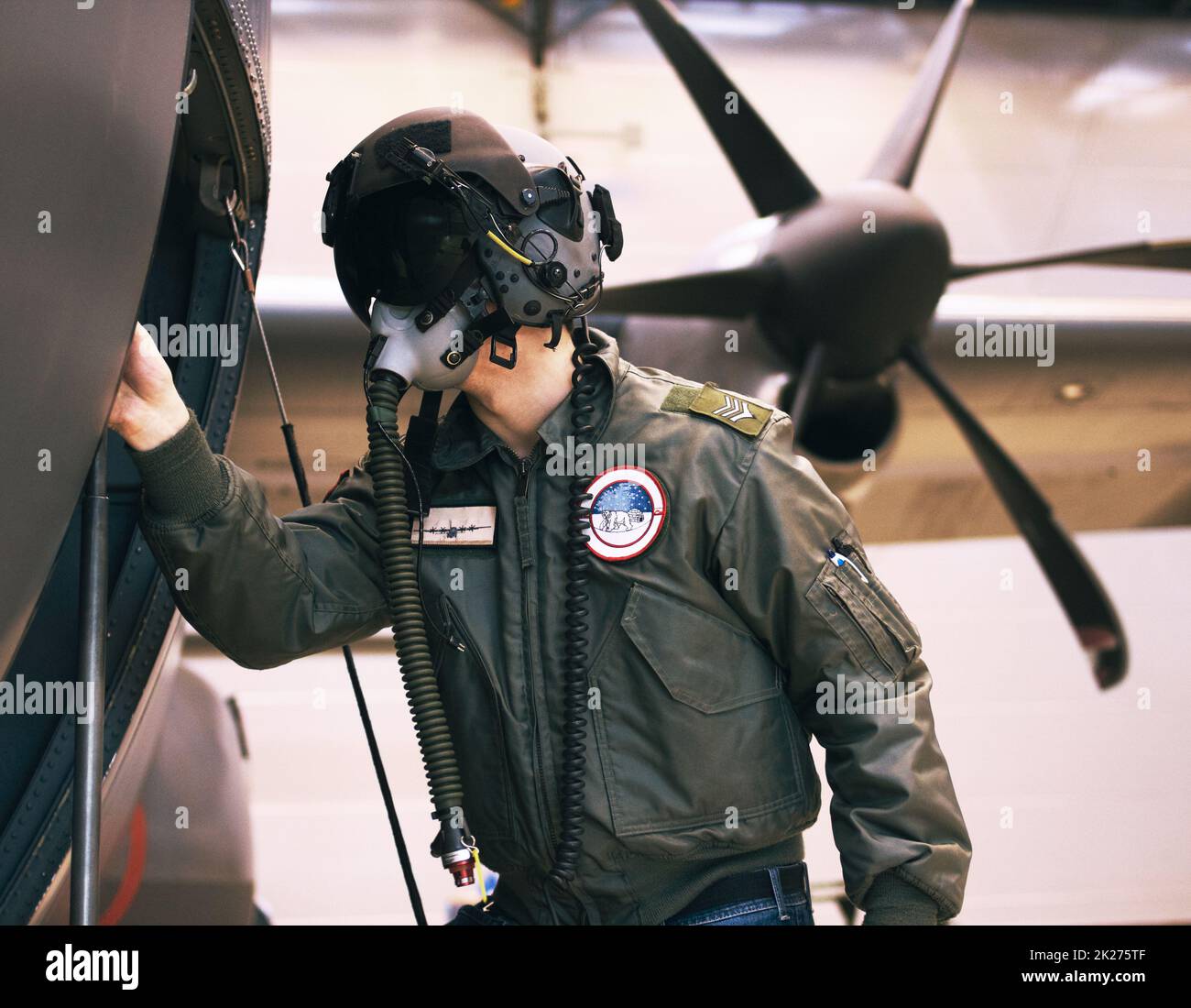 Prepping for war. Shot of a fighter pilot inspecting his aircraft. Stock Photo