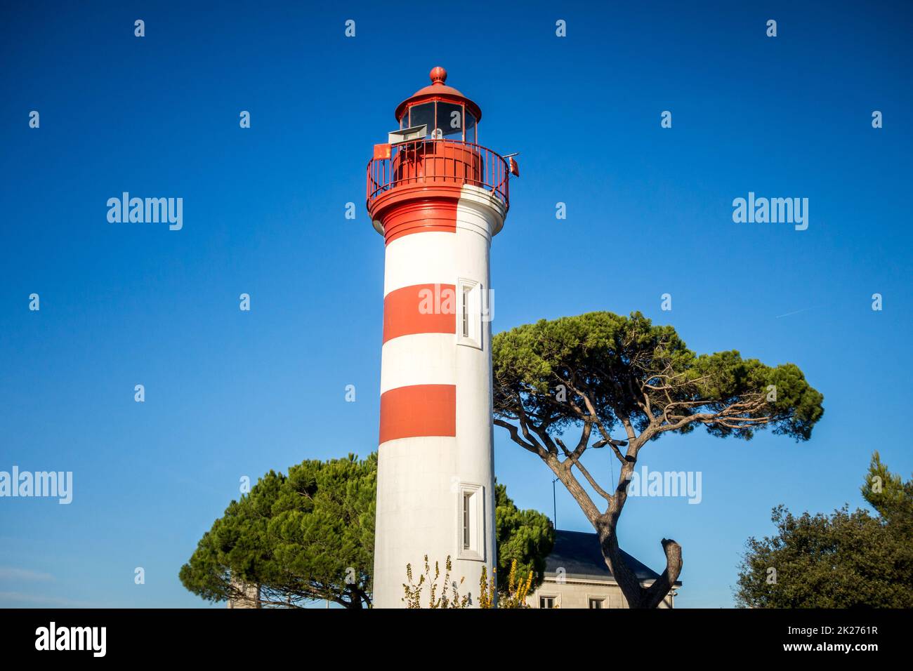 Old red lighthouse in La Rochelle harbor, France Stock Photo