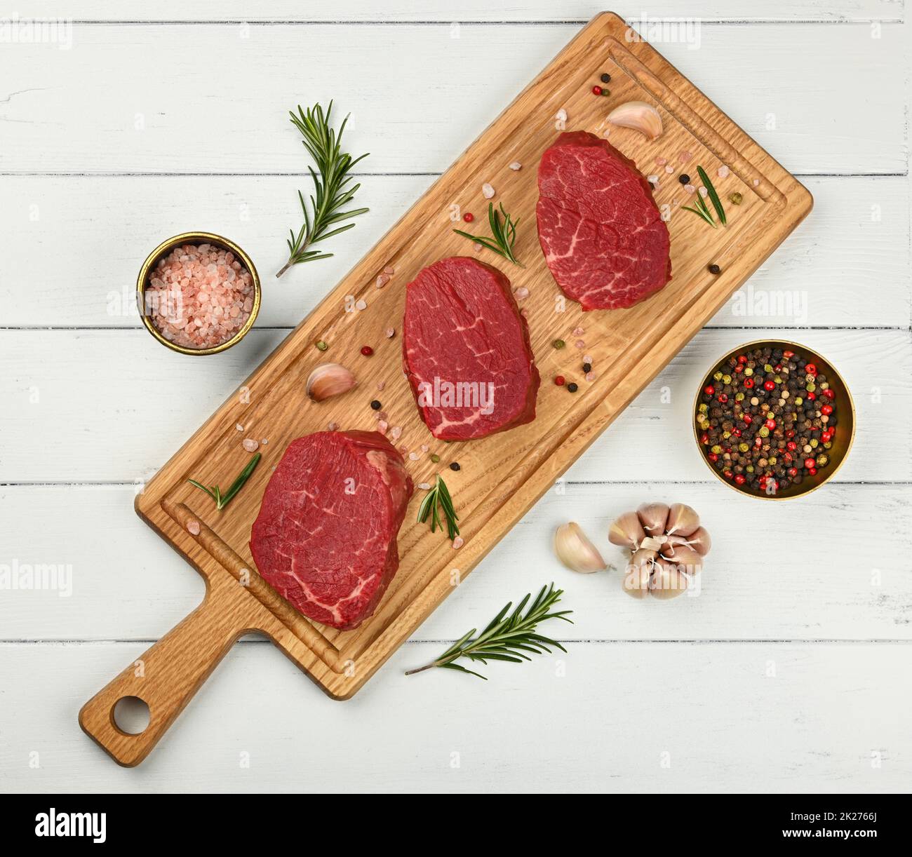 https://c8.alamy.com/comp/2K2766J/close-up-raw-beef-tenderloin-steak-on-board-2K2766J.jpg