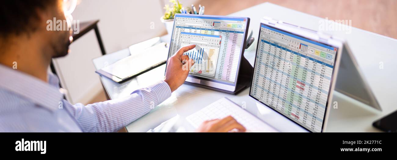 African American Analyst Using Spreadsheet Stock Photo