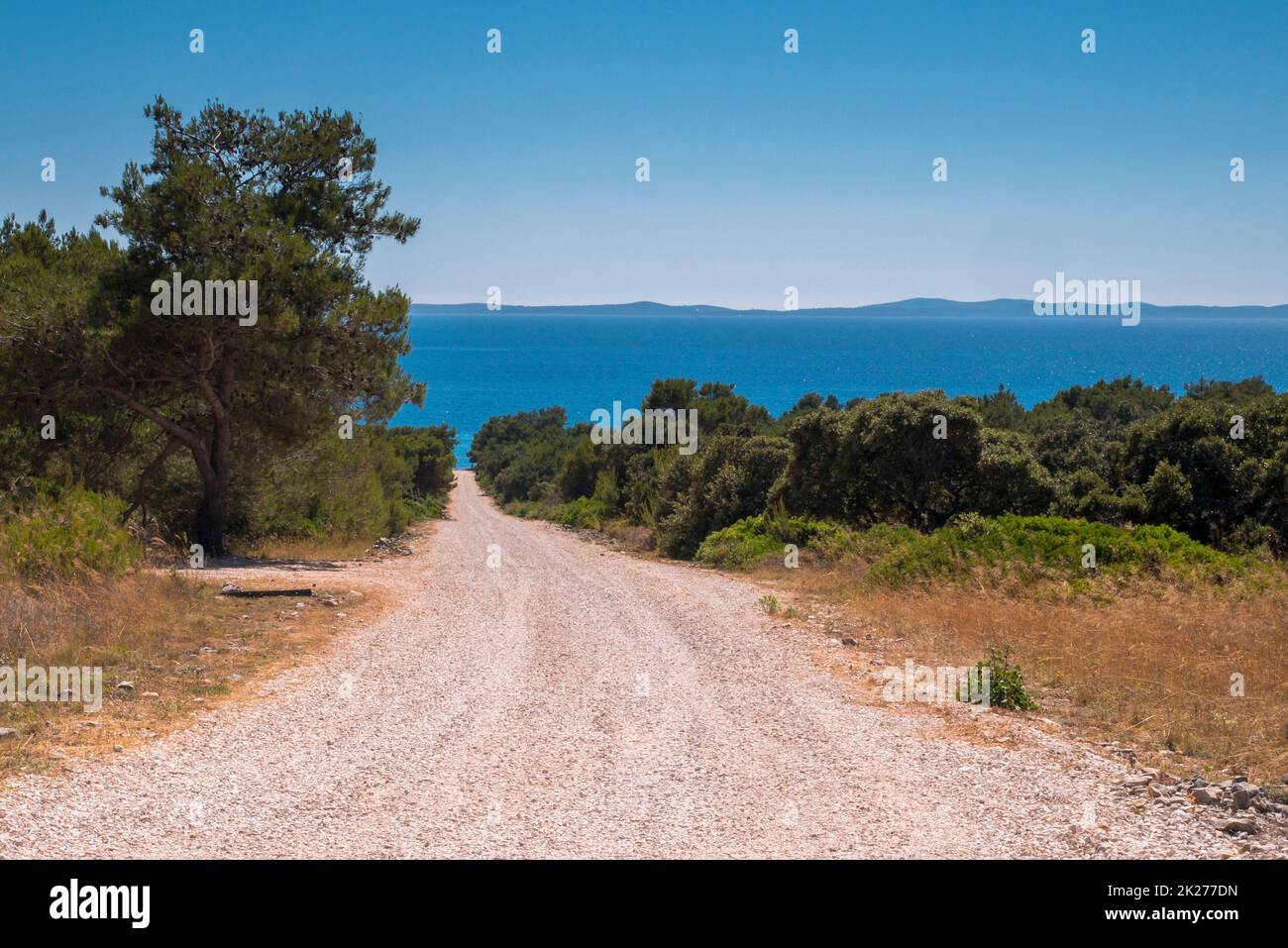 Look on a dusty road to the beach, Nin, Zadar County, Croatia Stock Photo