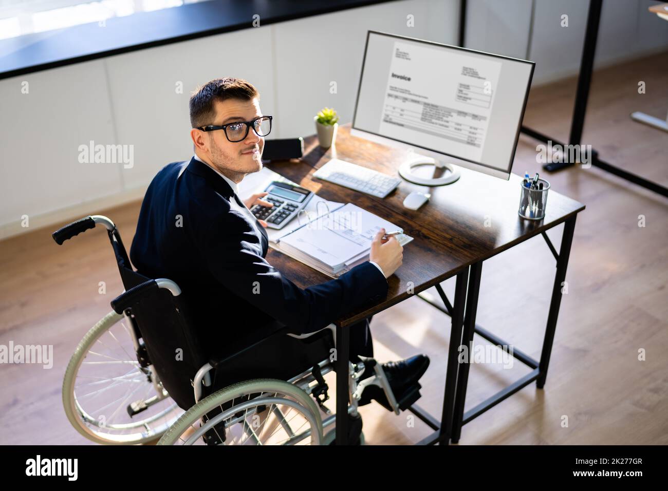 Accountant Using Tax Software In Office. Invoice Bill Stock Photo