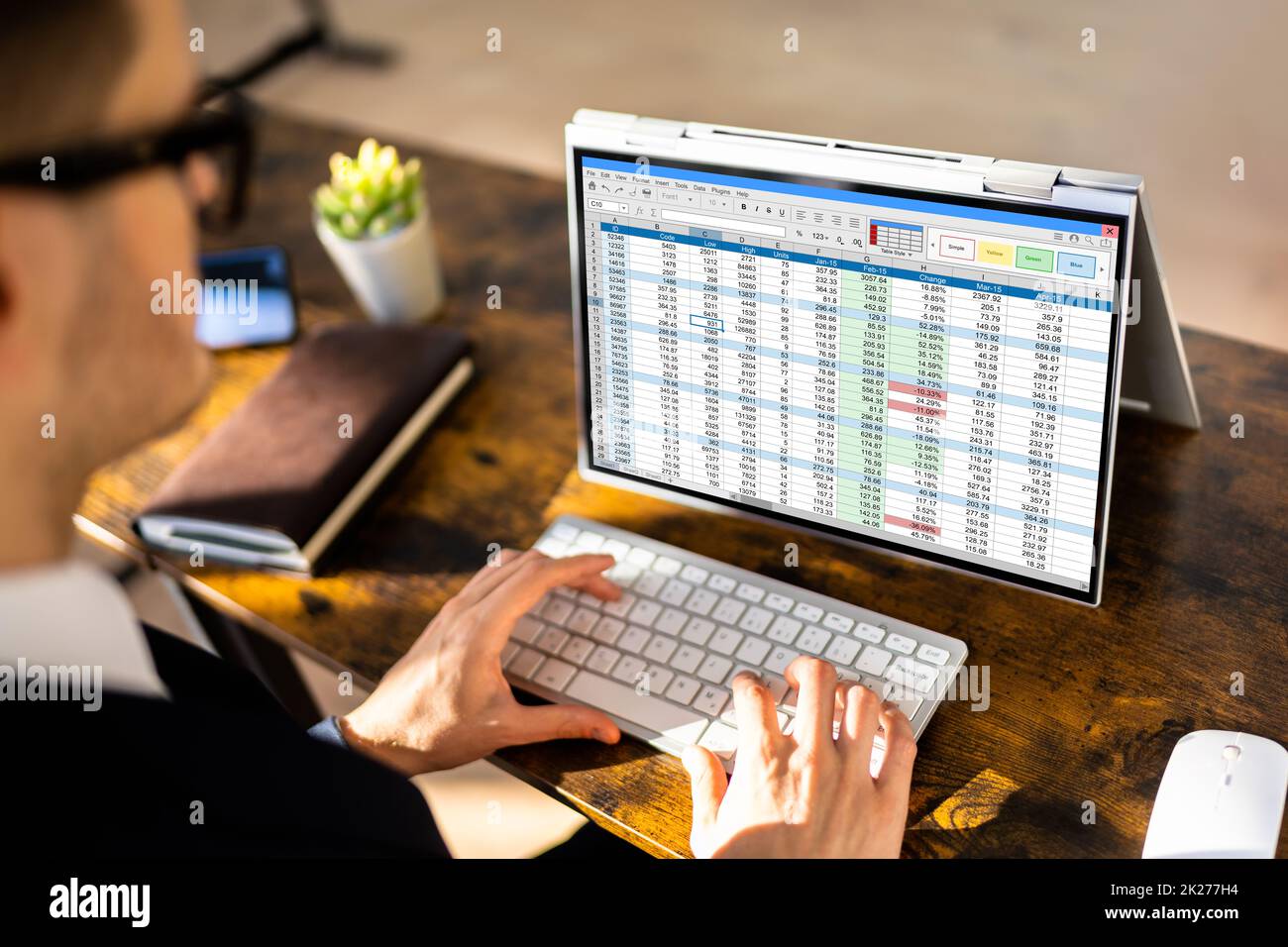 Electronic Spreadsheet Analyst Or Auditor Using Software Stock Photo