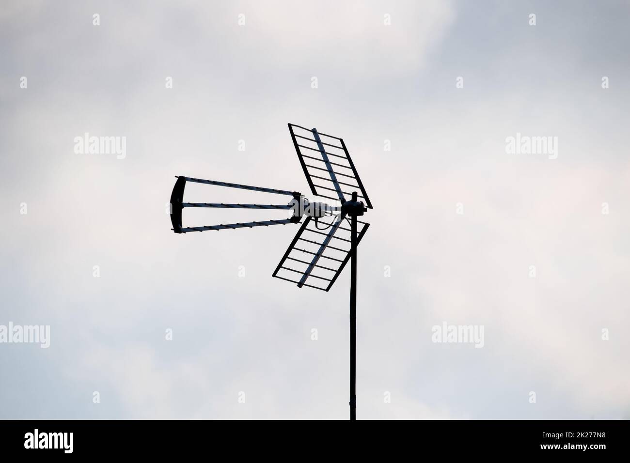 Television antenna against sky. Antenna for receiving radio waves. Stock Photo