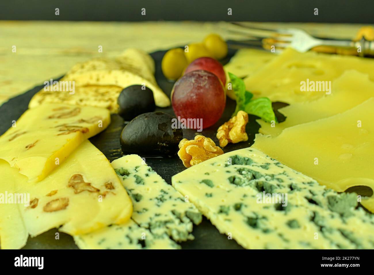 Cheese plat. Emmental, Camembert cheese, blue cheese, bread sticks