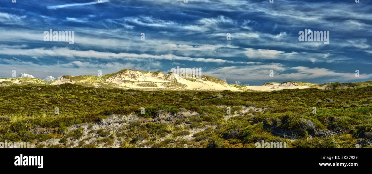 Idyllic huge wander dunes with sunlight beautiful clouds and blue sky Sylt Germany Stock Photo