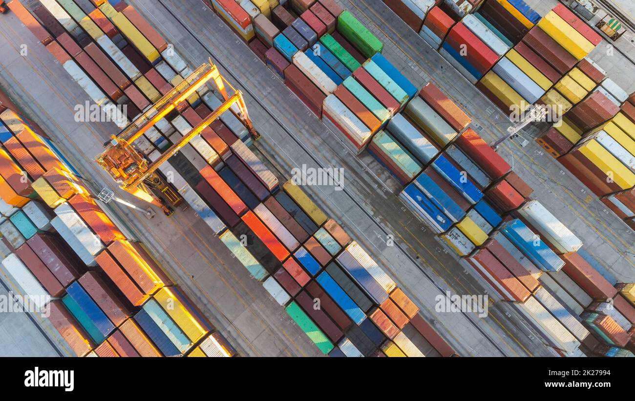 Aerial view of shipping container port terminal. Colourful pattern of containers in harbor. Maritime logistics global inport export trade transportation. Stock Photo