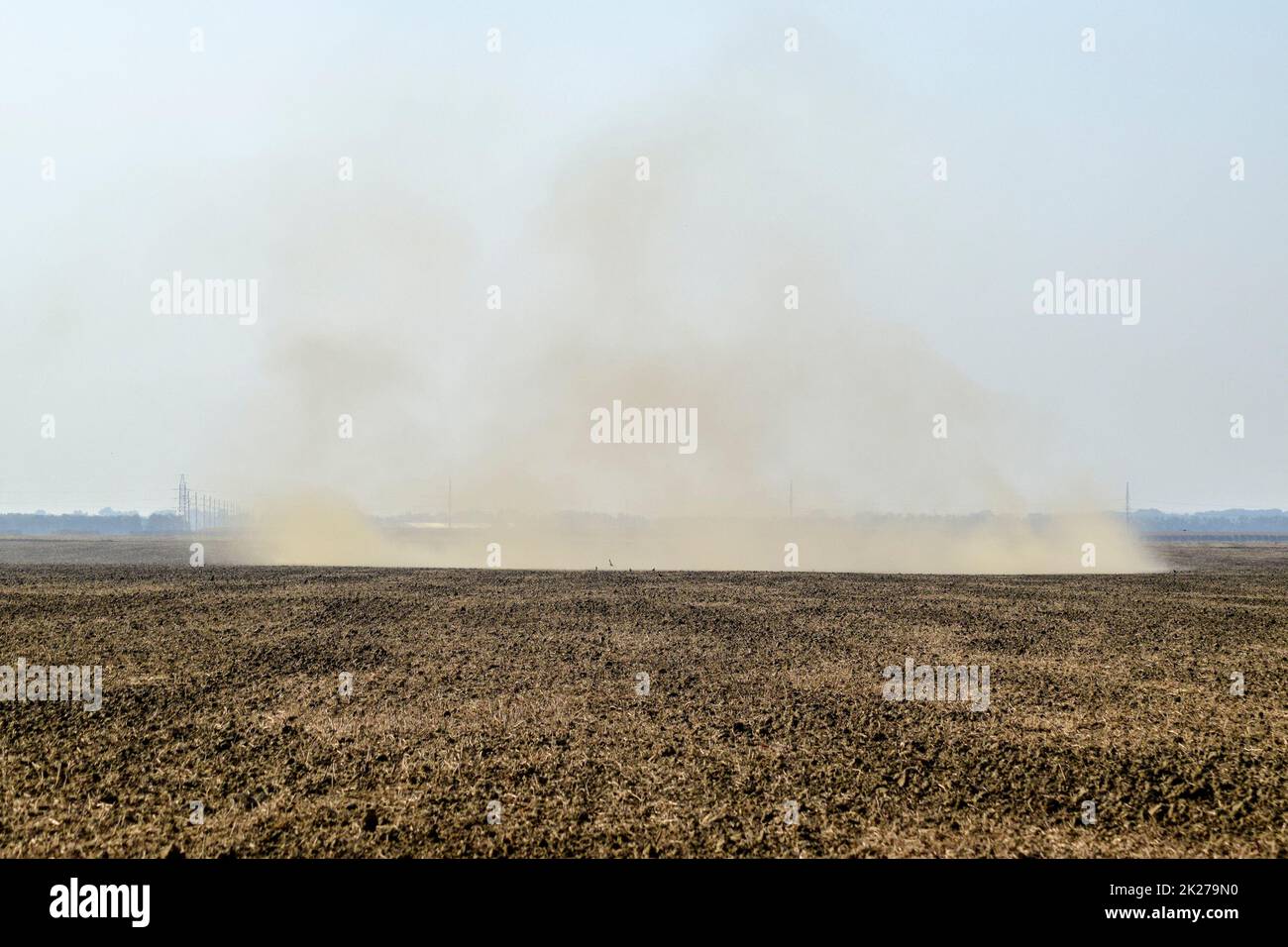 Dust storm. Tornado in the field. Clubs of dust. Stock Photo