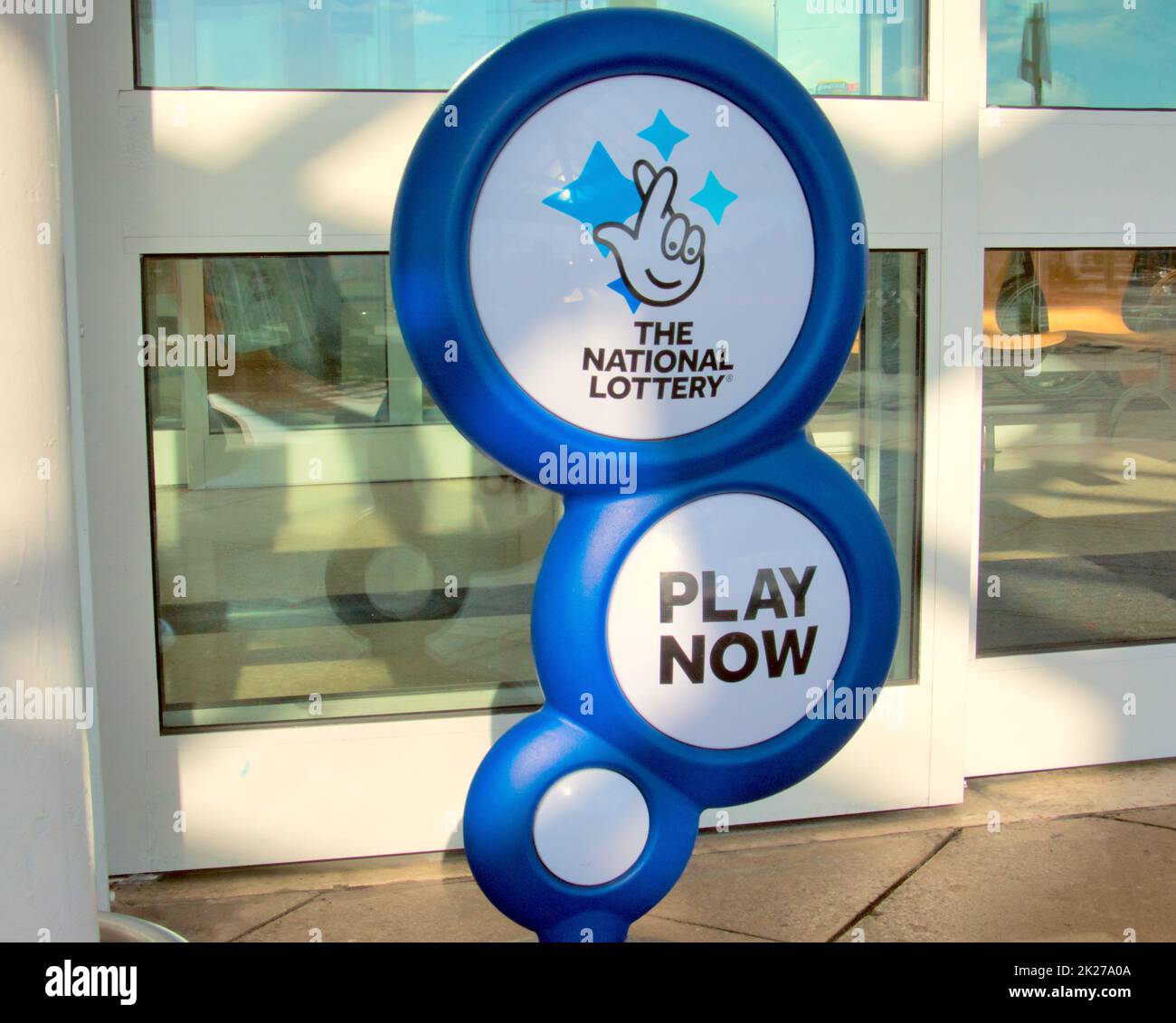 The national lottery advertising display stand play now in Glasgow, Scotland, UK Stock Photo