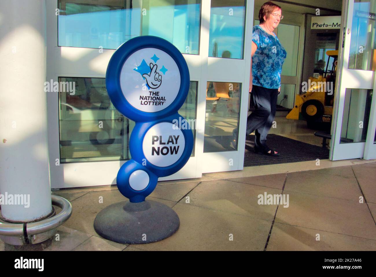 The national lottery advertising display stand play now in Glasgow, Scotland, UK Stock Photo