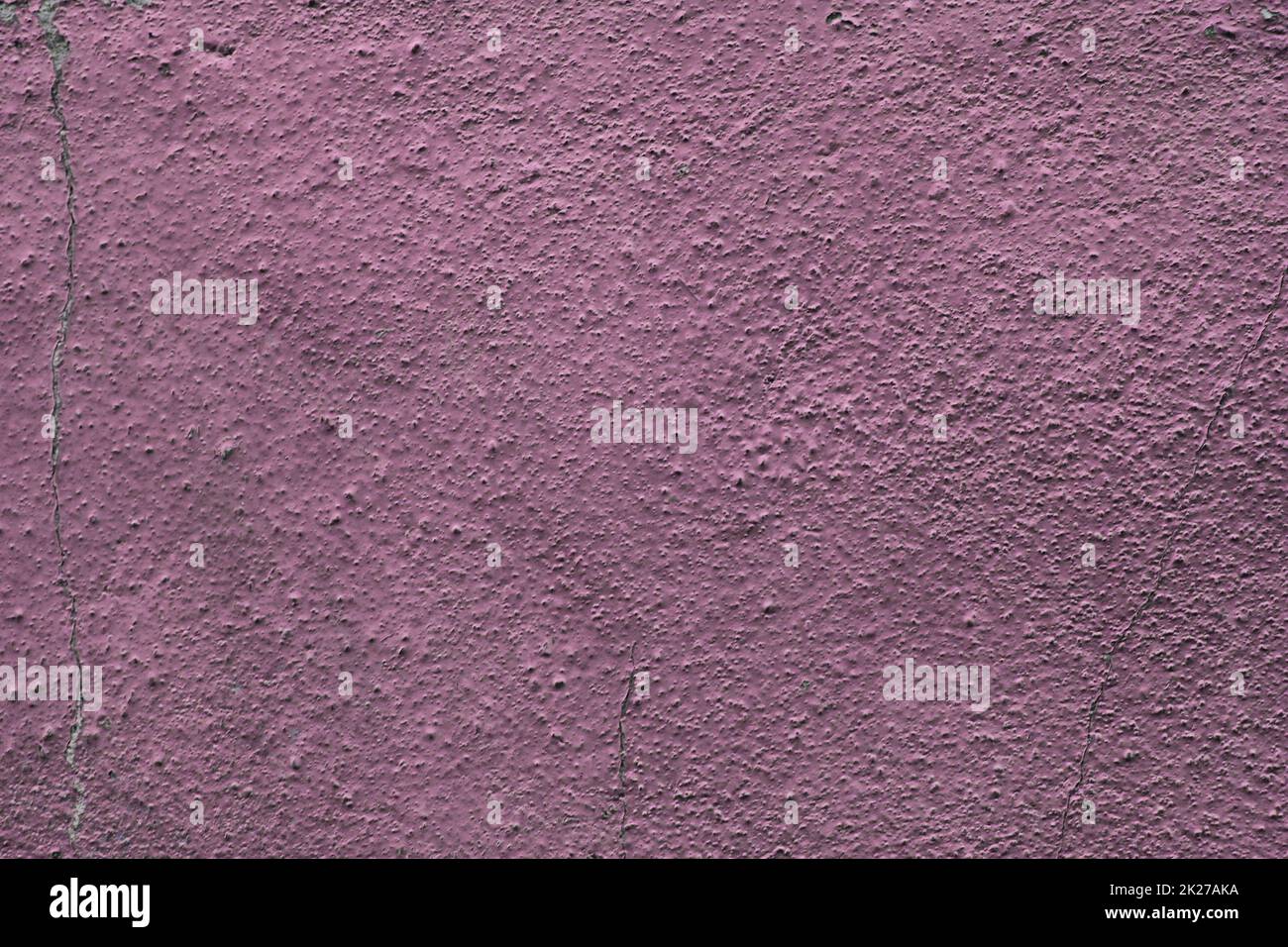Detailed and colorful close up at cracked and peeling paint on concrete wall textures in high resolution Stock Photo