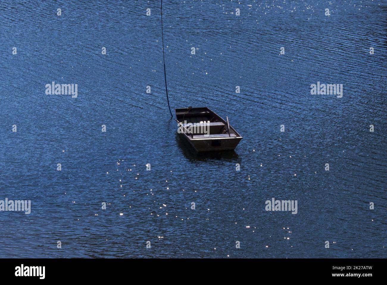 Little boat in the middle of the dam 2 Stock Photo